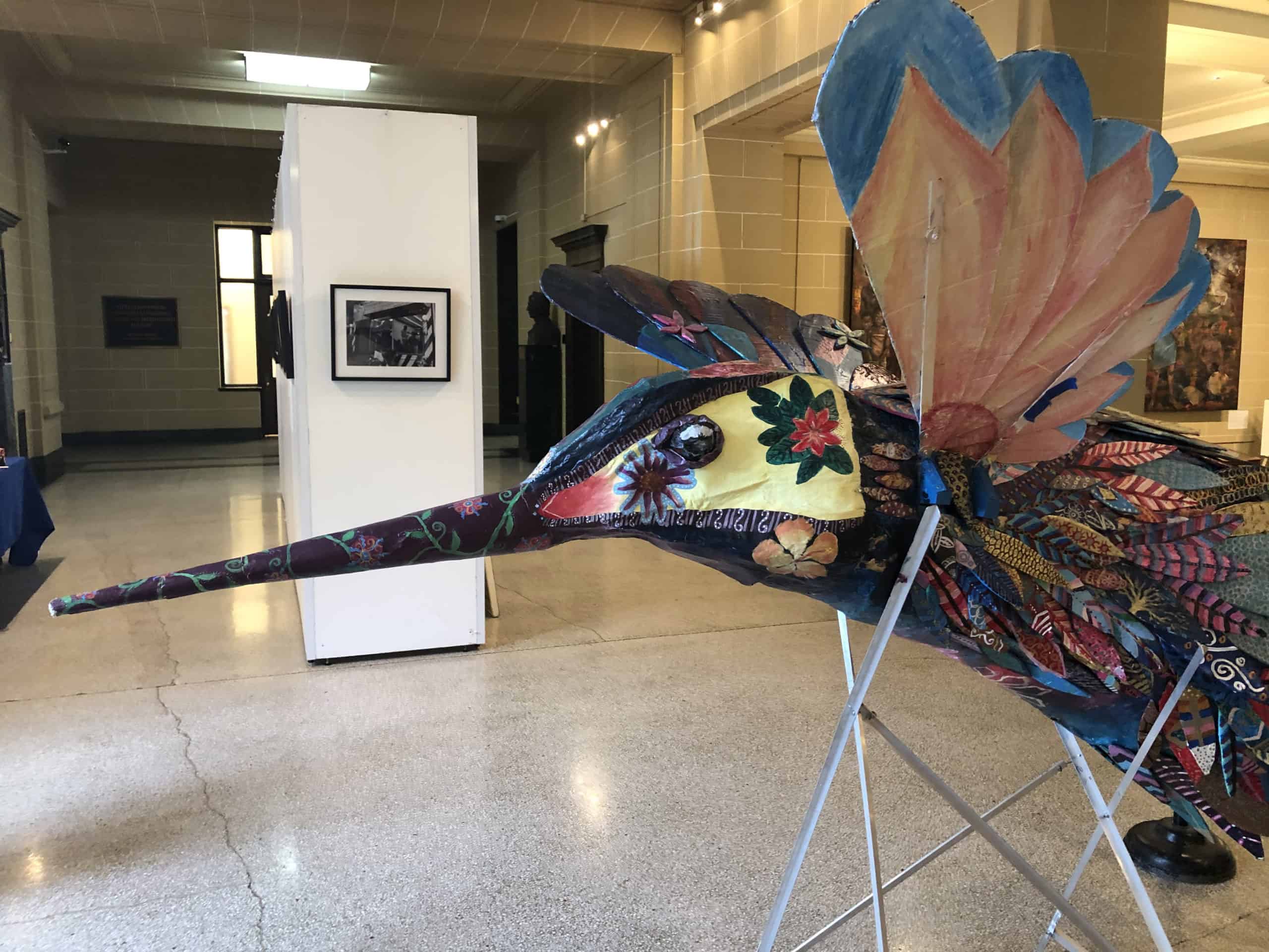 The Libertad monarch butterfly piñata on display in a gallery