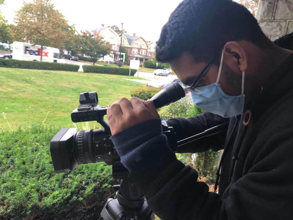A CCATE student filming with a video camera